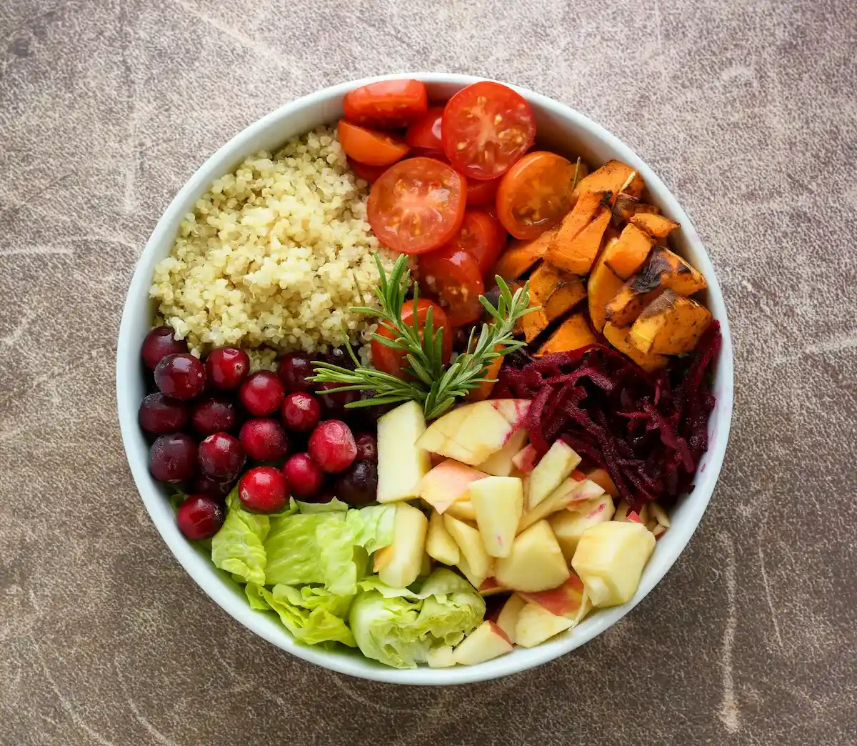 Colorful plate with whole foods, vegetables, and grains