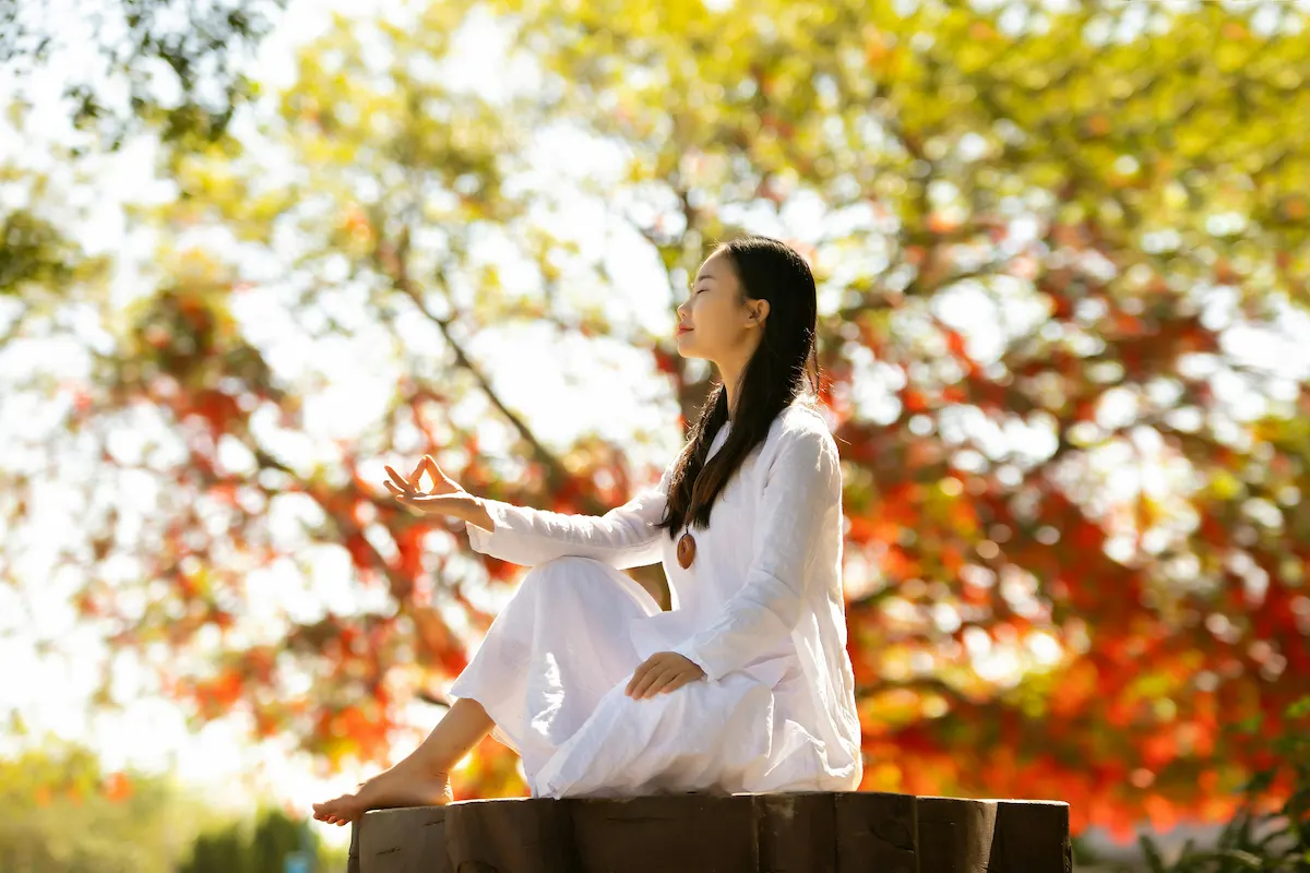 Person meditating peacefully in nature