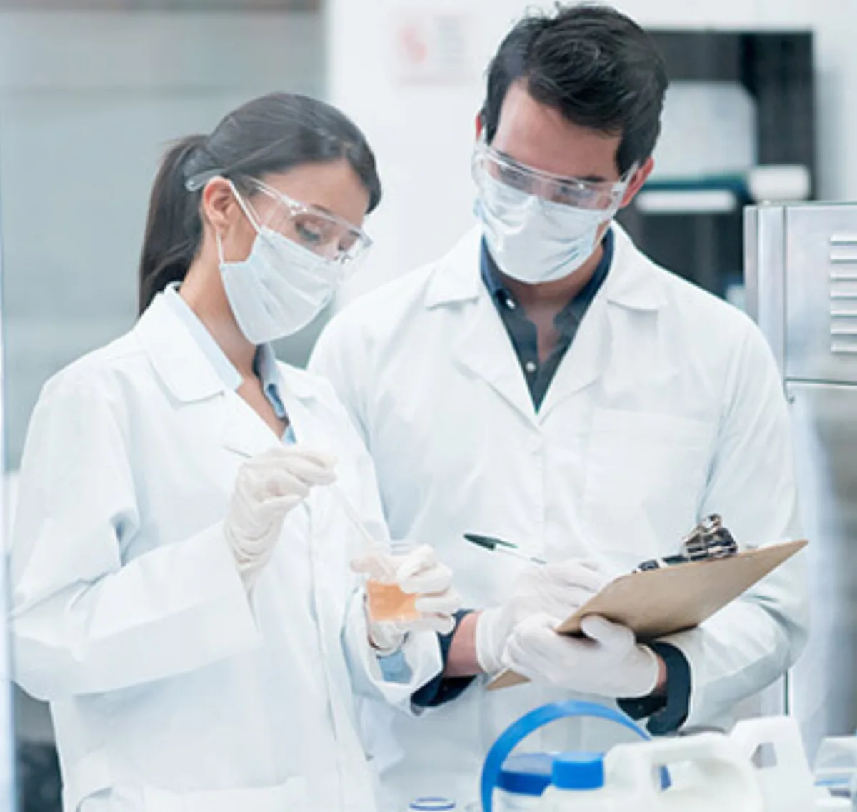 Scientists in a cGMP-compliant laboratory facility checking supplement quality