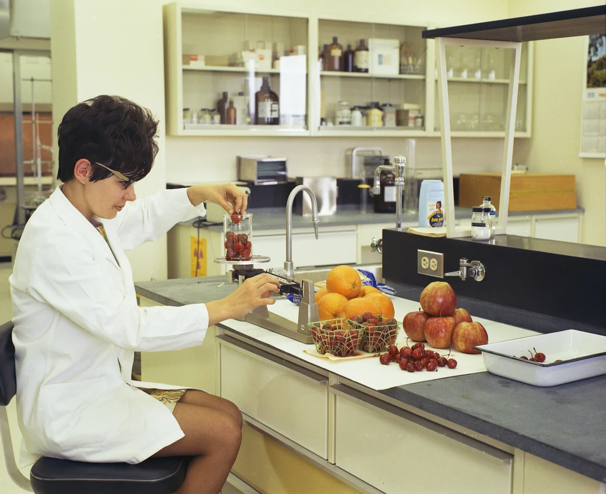 Scientist reviewing nutrition data and research papers